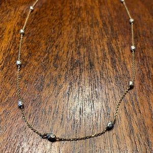 Necklace with detailed beads